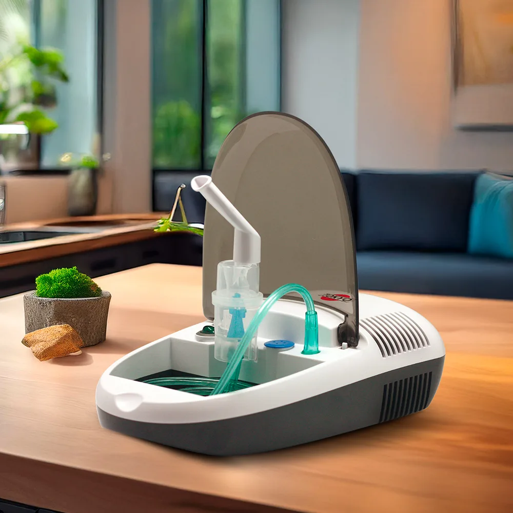 Nebulizador de sobremesa blanco y gris con tubo transparente conectado al conjunto nebulizador. - Vista 2