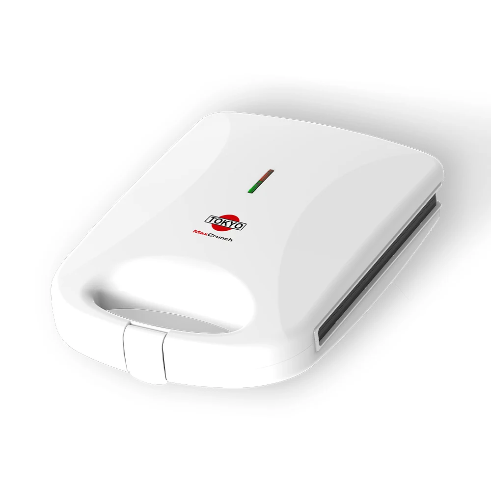 Sandwichera Tokyo MaxCrunch blanca con placas para cuatro panes, asa integrada y ventana indicadora roja y verde.