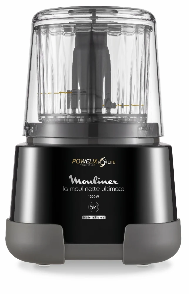 Picadora Moulinex negra y gris con recipiente transparente, tapa y conjunto de cuchillas central visible.