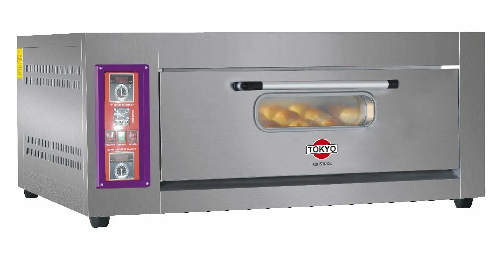 Horno industrial plateado con puerta frontal con ventana y panel de controles vertical a la izquierda.